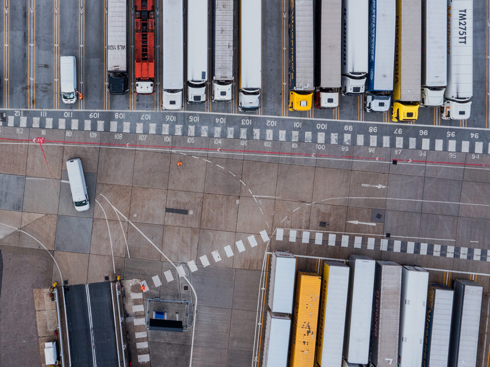 Aerial view of harbor and trucks parked along side each other getting ready for embarking the Dover Ferry to Calais